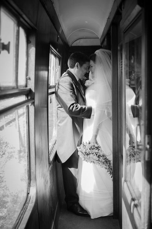 Emma and James share a moment aboard the beautifully restored railway carriages at Buckinghamshire Railway Centre. Captured by Veiled Productions.