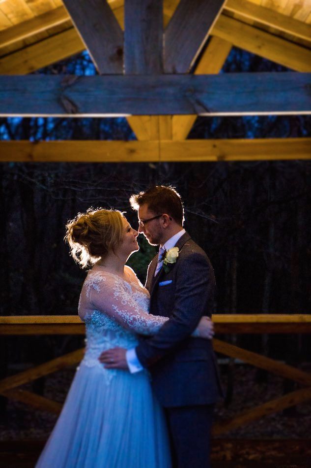 Hannah and Mike Winter Wedding at Bury Court Barn on the terrace by Em J Photography. Videography by Veiled Productions 