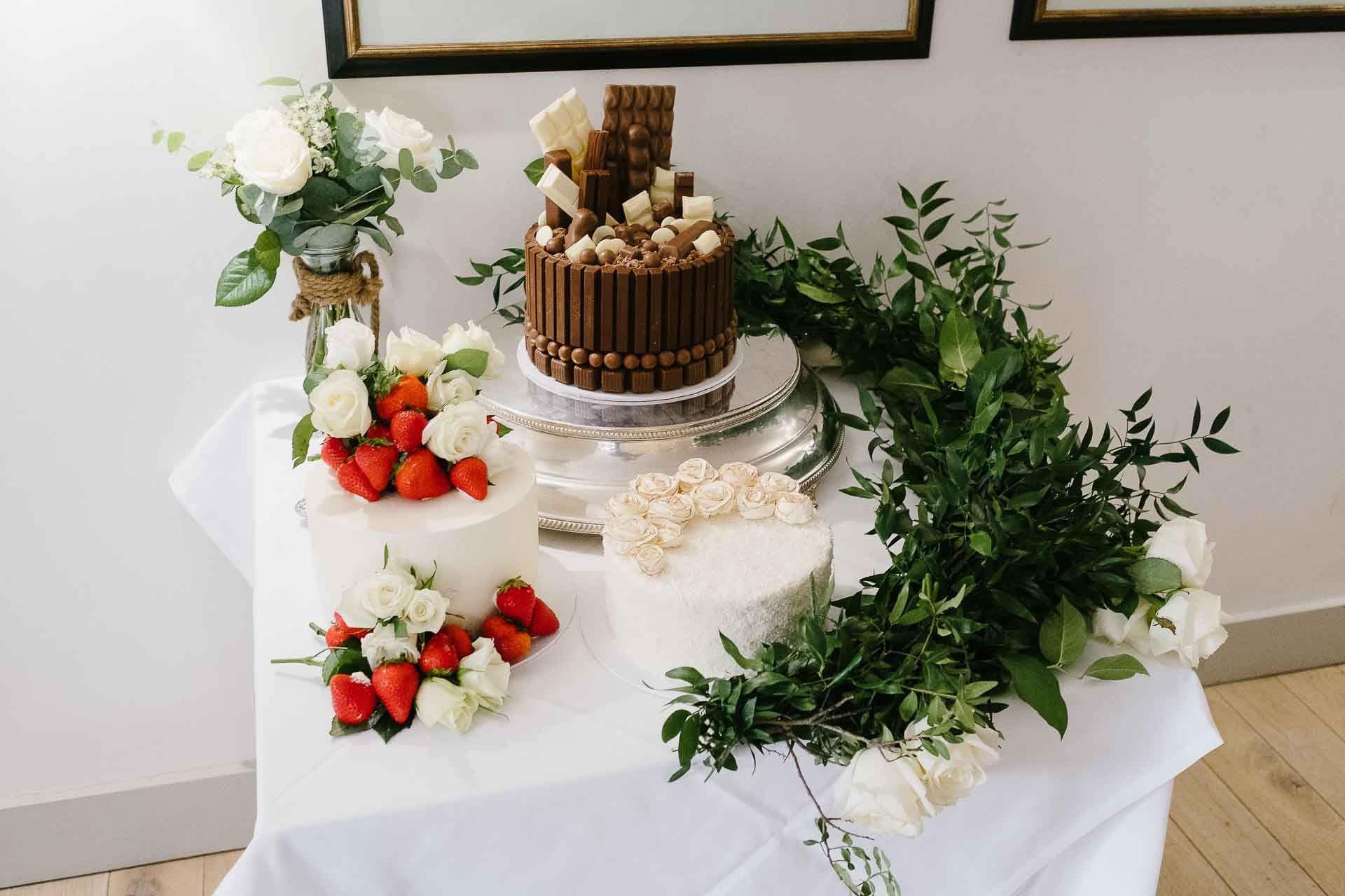 Three wedding cakes - chocolate, strawberry and passion fruit for Adrian and Nadia's wedding celebrations. Cakes created by Lea's Cakes & Bakes. Photography by Des Dubber Photography. Videography by Veiled Productions - Minster Mill wedding videographer