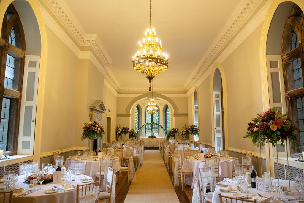 Aimee and Simon's wedding breakfast seating with stunning decor and beautiful florals. Photo thanks to Mark Lord Photography.