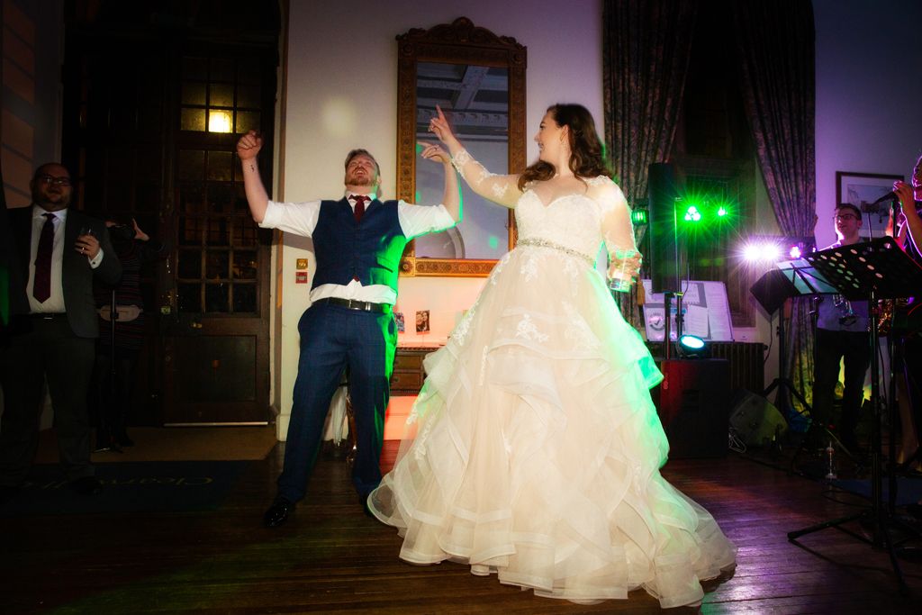 Aimee and Simon dancing to Ubermeister band at their wedding at Clearwell Castle. Photo thanks to Mark Lord Photography.