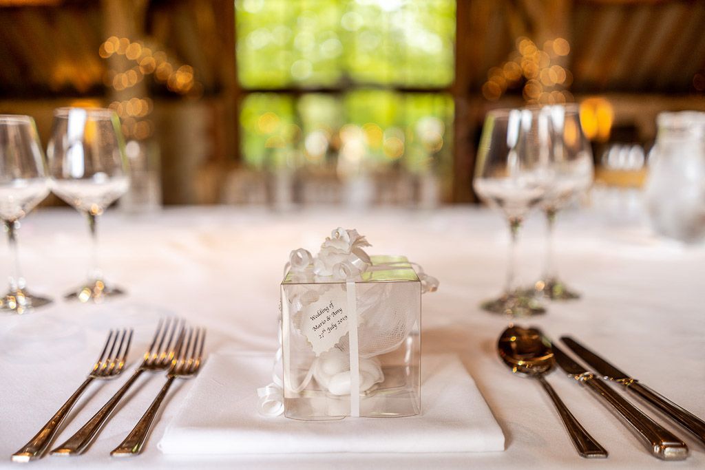 Italian wedding favours on the tables. Wedding photo by Allister Freeman. Videography by Veiled Productions - unique wedding videographer Bury Court Barn