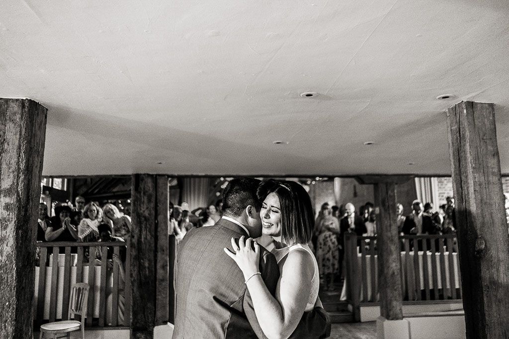 Amy and Mario dancing their first dance. Wedding photo by Allister Freeman. Videography by Veiled Productions - unique wedding videographer Bury Court Barn