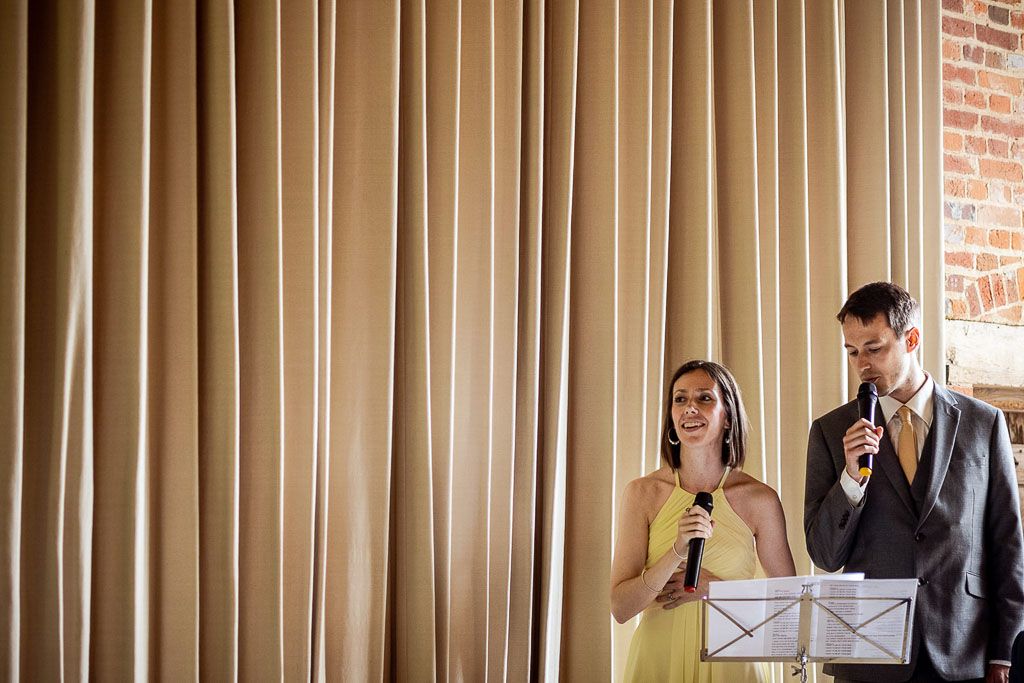 Amy's family performing during the personal civil ceremony. Wedding photo by Allister Freeman. Videography by Veiled Productions - unique wedding videographer Bury Court Barn