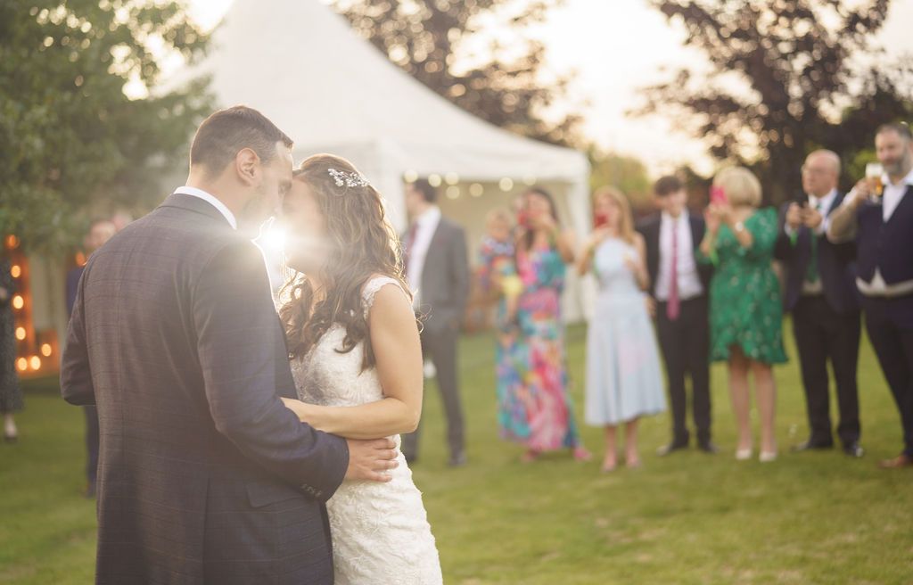 Bex and Dan dancing their first dance in the gardens at Redhouse Barn. Beautiful photo by J Bidmead Photography.