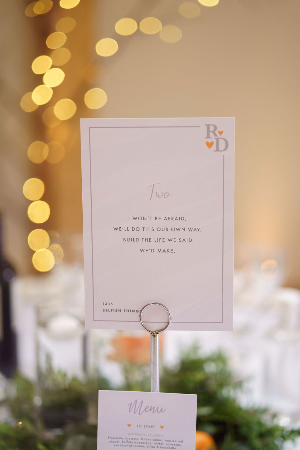 Table numbers with music quotes at Bex and Dan wedding - sophisticated wedding reception at Redhouse Barn
