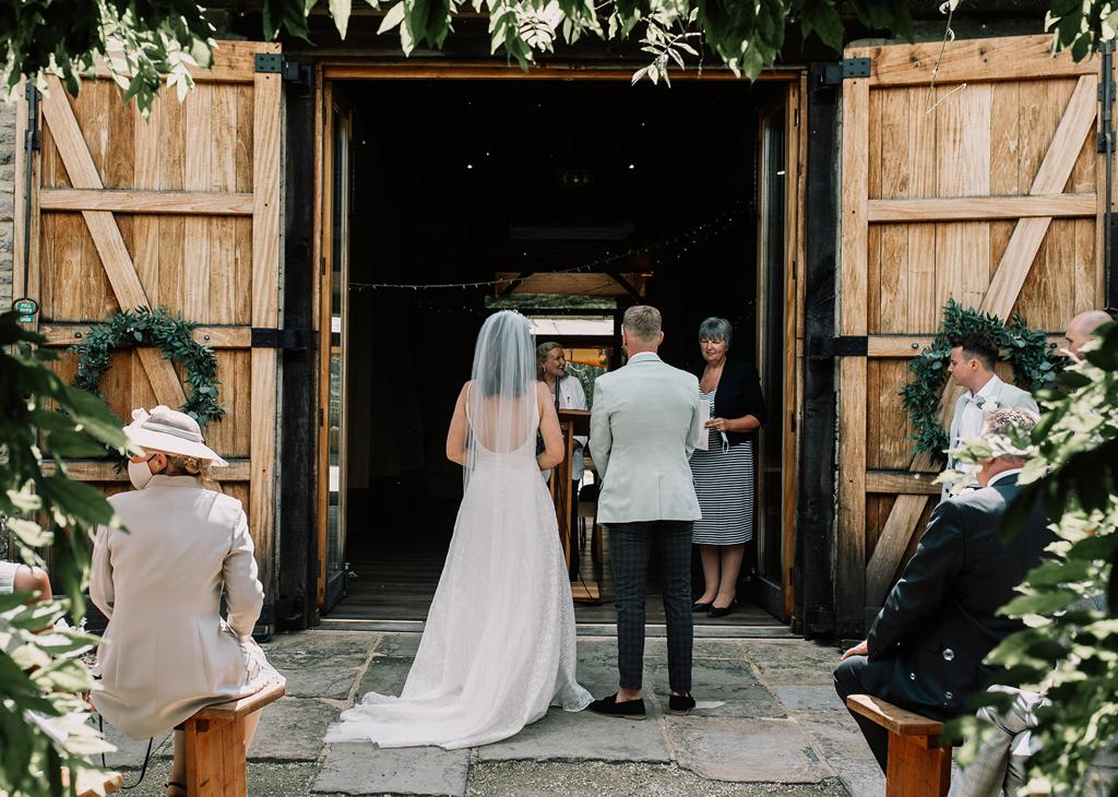 Erin and Vinnie during their outdoor civil ceremony at The Tythe Barn - photo by The Kensington Photographer