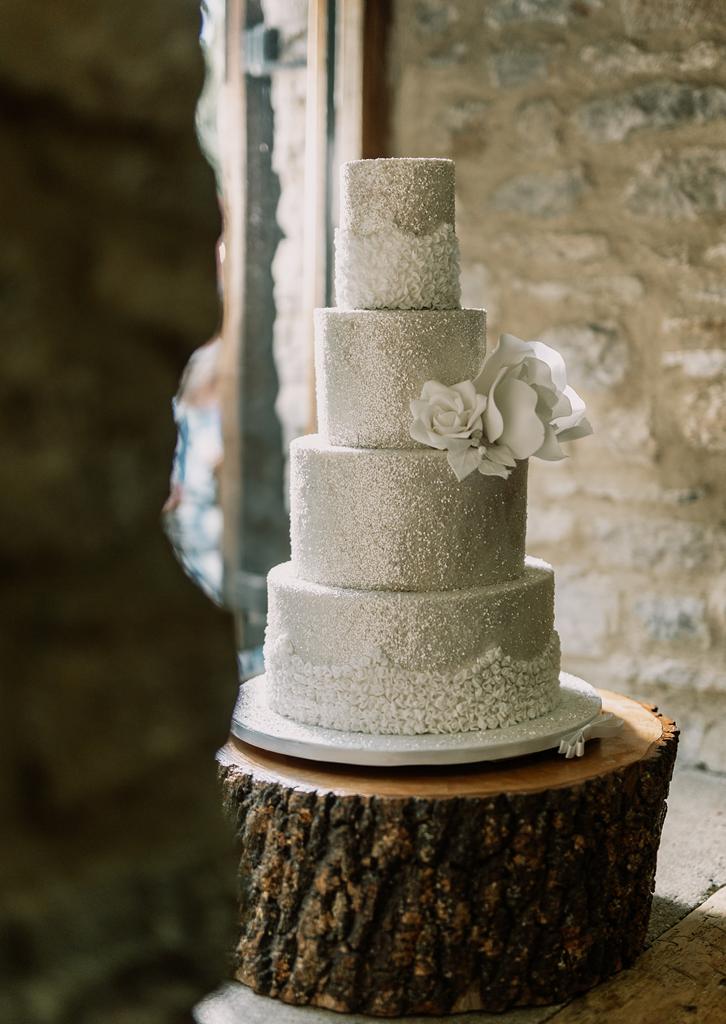 Four tier beautiful glitter wedding cake with piping and flower details by Hamiltons Cake - photography by The Kensington Photographer