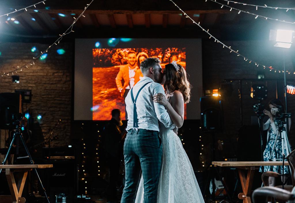 Erin and Vinnie celebrating their first dance as husband and wife on the dancefloor of The Tythe Barn - photography by The Kensington Photographer - videography by Veiled Productions - The Tythe Barn wedding videographer