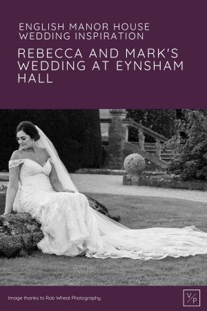 Bride Rebecca sitting on the water fountain at Eynsham Hall in Oxfordshire - Photo by Rob Wheal Photography