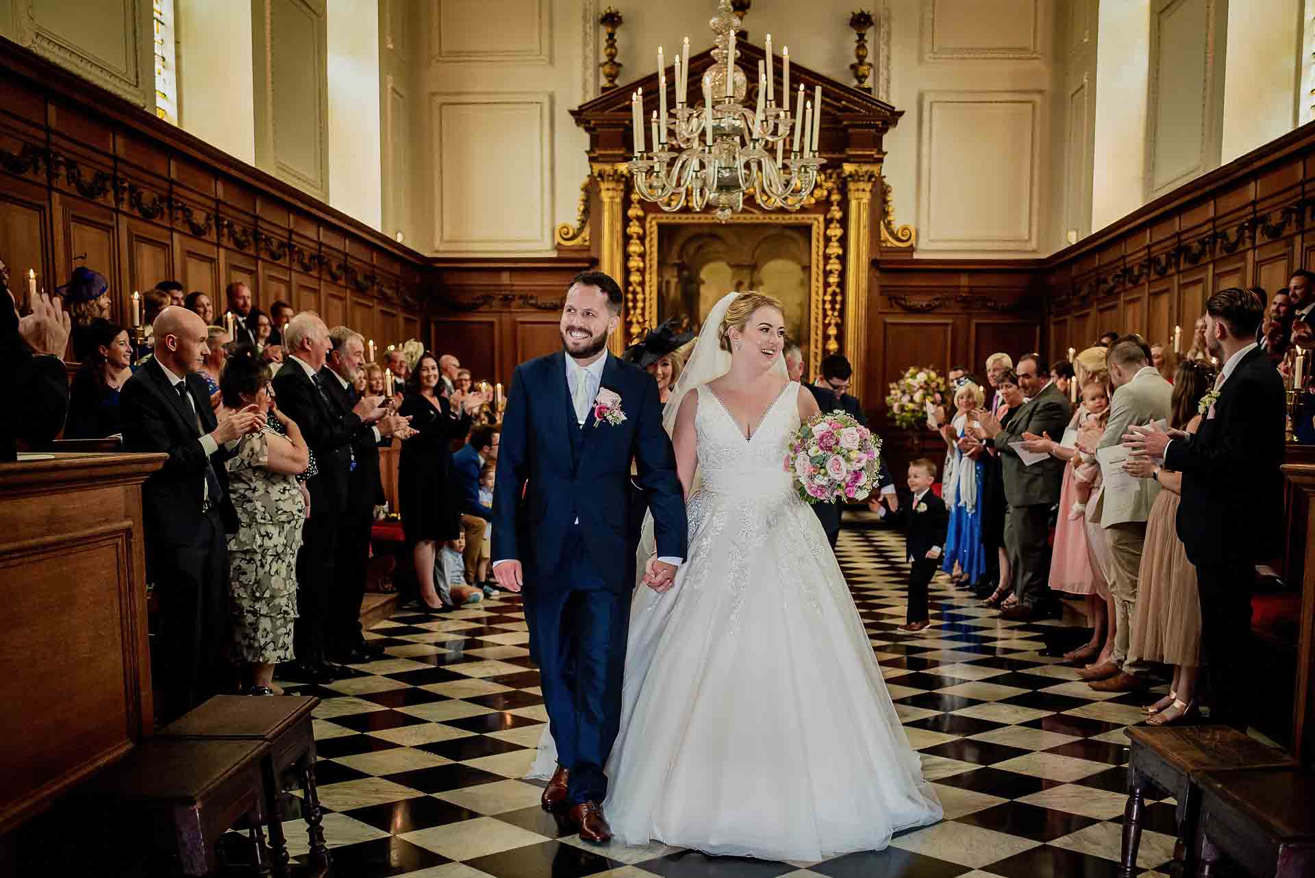 Leah and Nic exiting Emmanuel College Chapel as the new Mr and Mrs Hill. Photo thanks to Damien Vickers Photography.