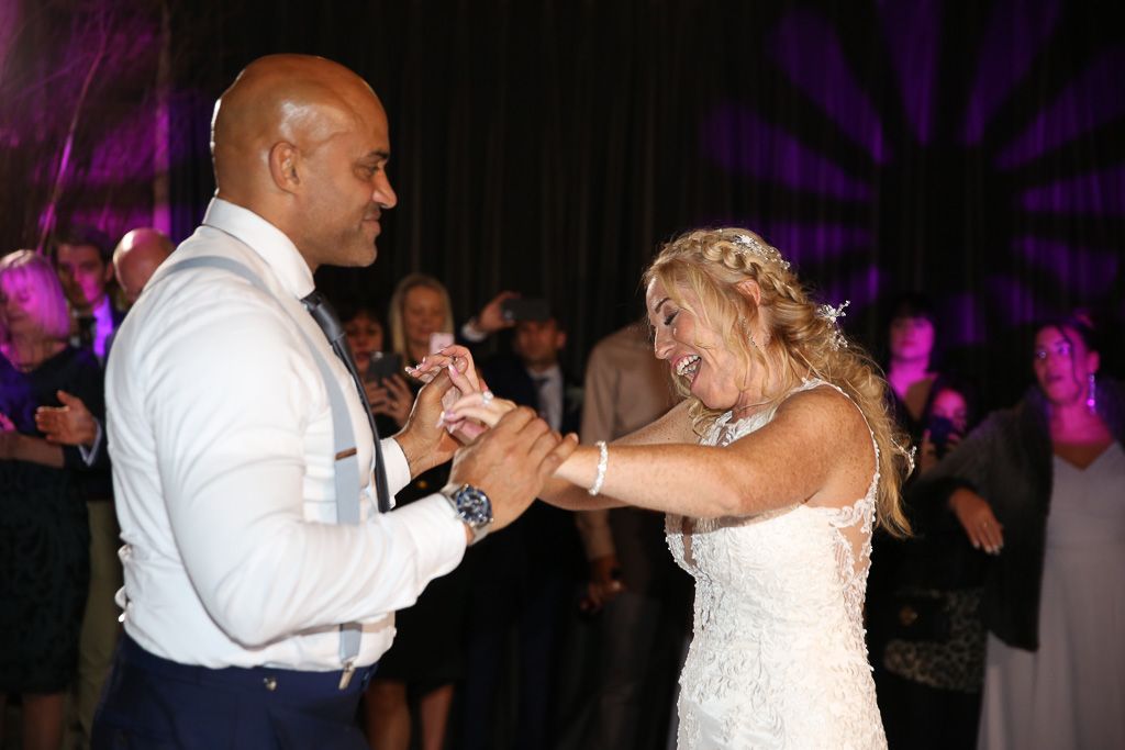 First dance on the dancefloor at The Farmhouse at Redcoats - Photography by Wrapp Weddings - Videography by Veiled Productions - The Barns at Redcoats wedding videographer