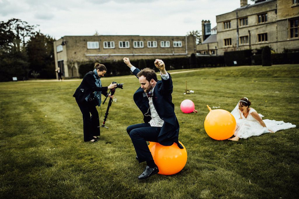 Rachel from Veiled Productions filming Jess and Sam having a race on space hoppers on their wedding day at Shuttleworth House. Fun wedding videography.