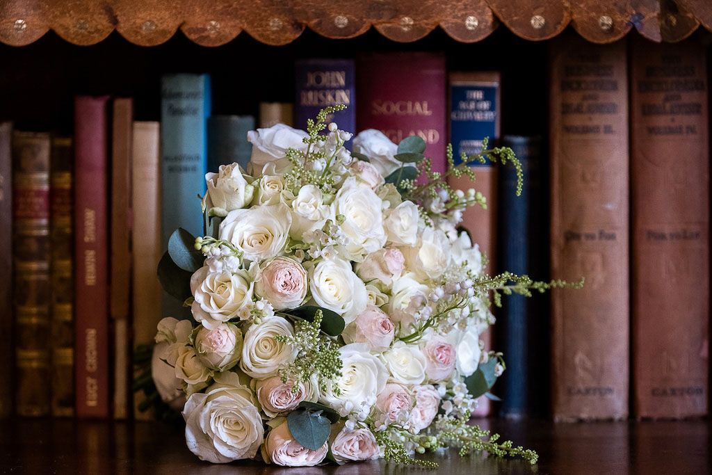Bridal bouquet with white and light pink roses - photography by Rob Wheal Photography | Oxfordshire wedding videography by Veiled Productions