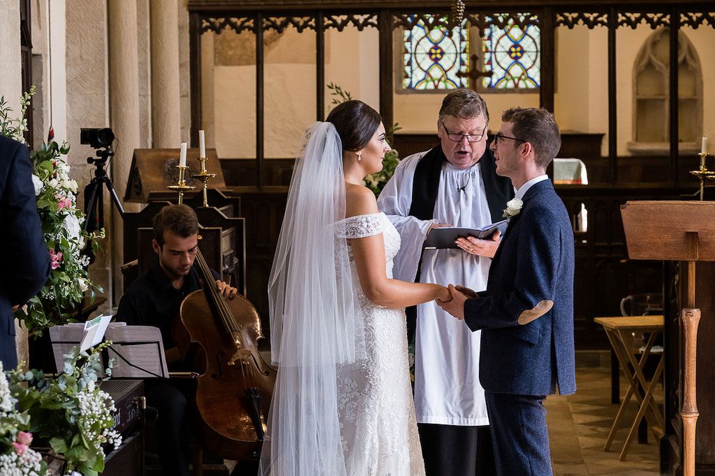 Rebecca and Mark making their wedding vows - photography by Rob Wheal Photography | Oxfordshire wedding videography by Veiled Productions