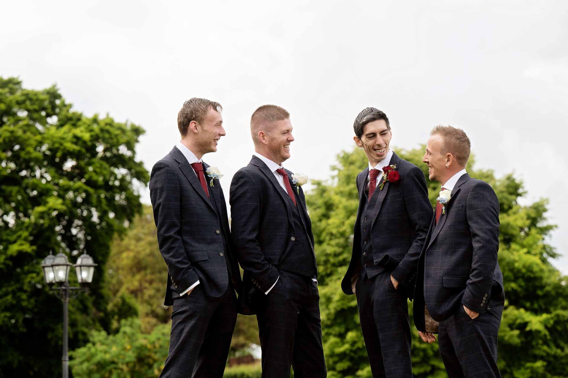 Ross and his groomsmen laughing with each other at Swynford Manor. Photography by Fountain Photography. Videography by Veiled Productions.