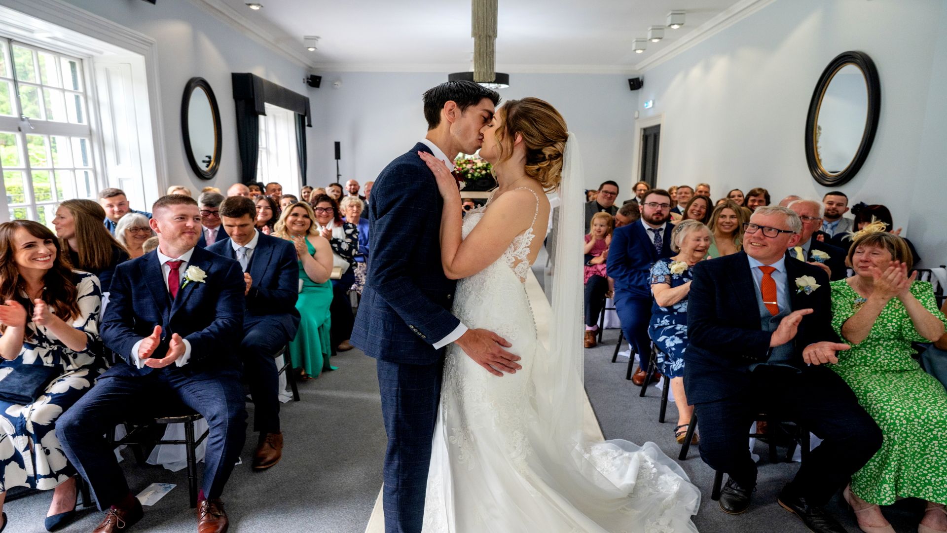 Sophie and Ross sealing their marriage with a kiss in front of their family and friends. Photo thanks to Fountain Photography.