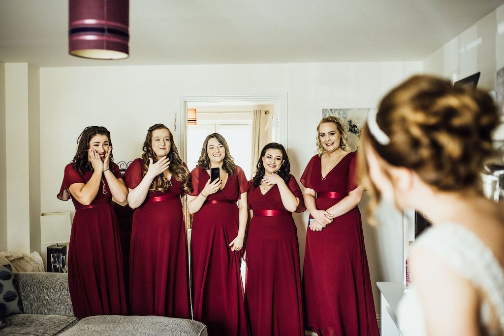 Jess' bridesmaids reaction to seeing her in her wedding dress for the first time. Photo courtesy of Michelle Wood Photographer.