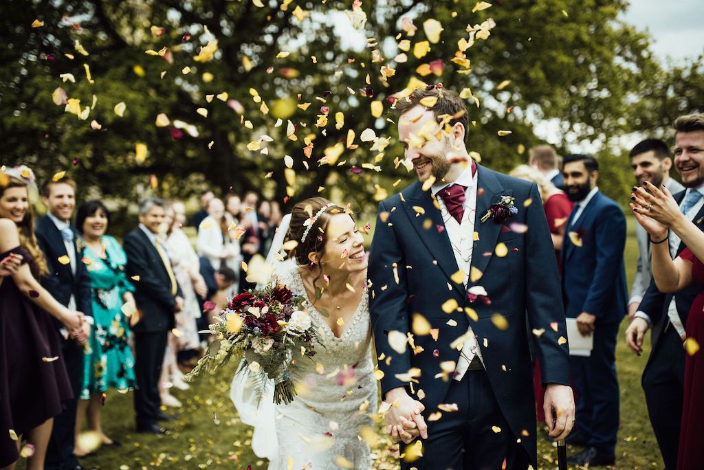Confetti throw in the grounds of Shuttleworth House - Jess and Sam wedding. Photo thanks to Michelle Wood Photographer. Shuttleworth House wedding videographer Veiled Productions.