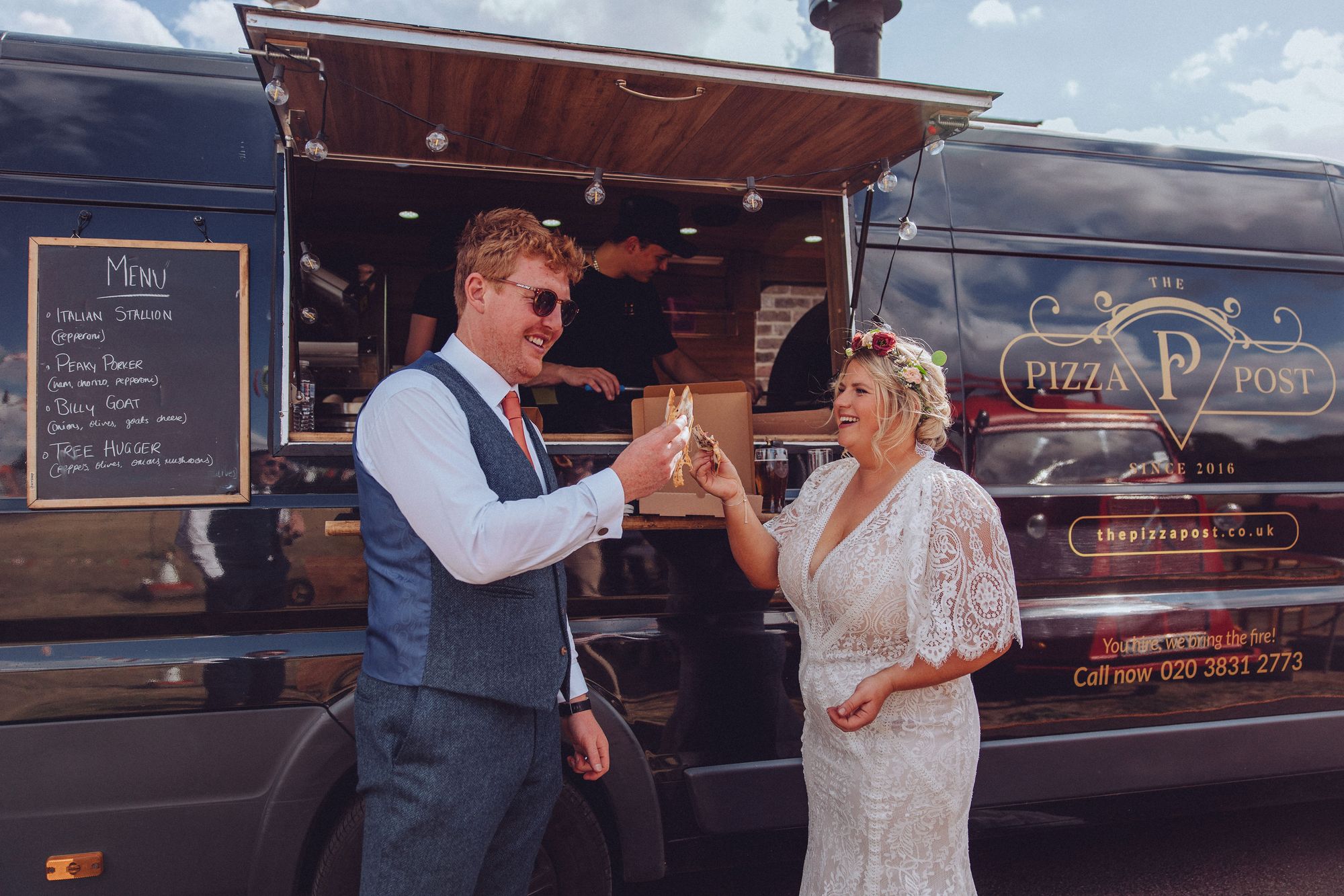 Nor and Dan celebrating their wedding with a slice of pizza 'toast' in front of Pizza Post van - cheers! Photo thanks to Fordtography.
