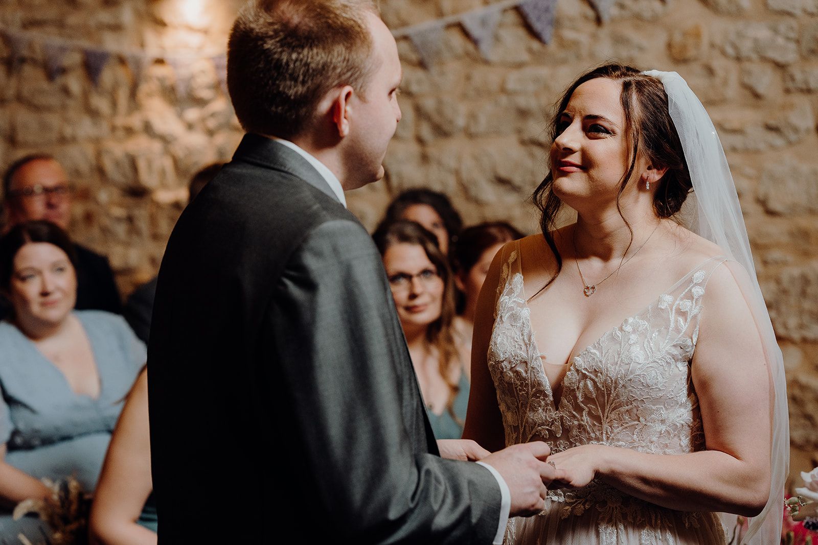 Georgie and James exchanging wedding rings during their wedding ceremony at Huntsmill Farm. Photo thanks to Sam and Steve Photography.