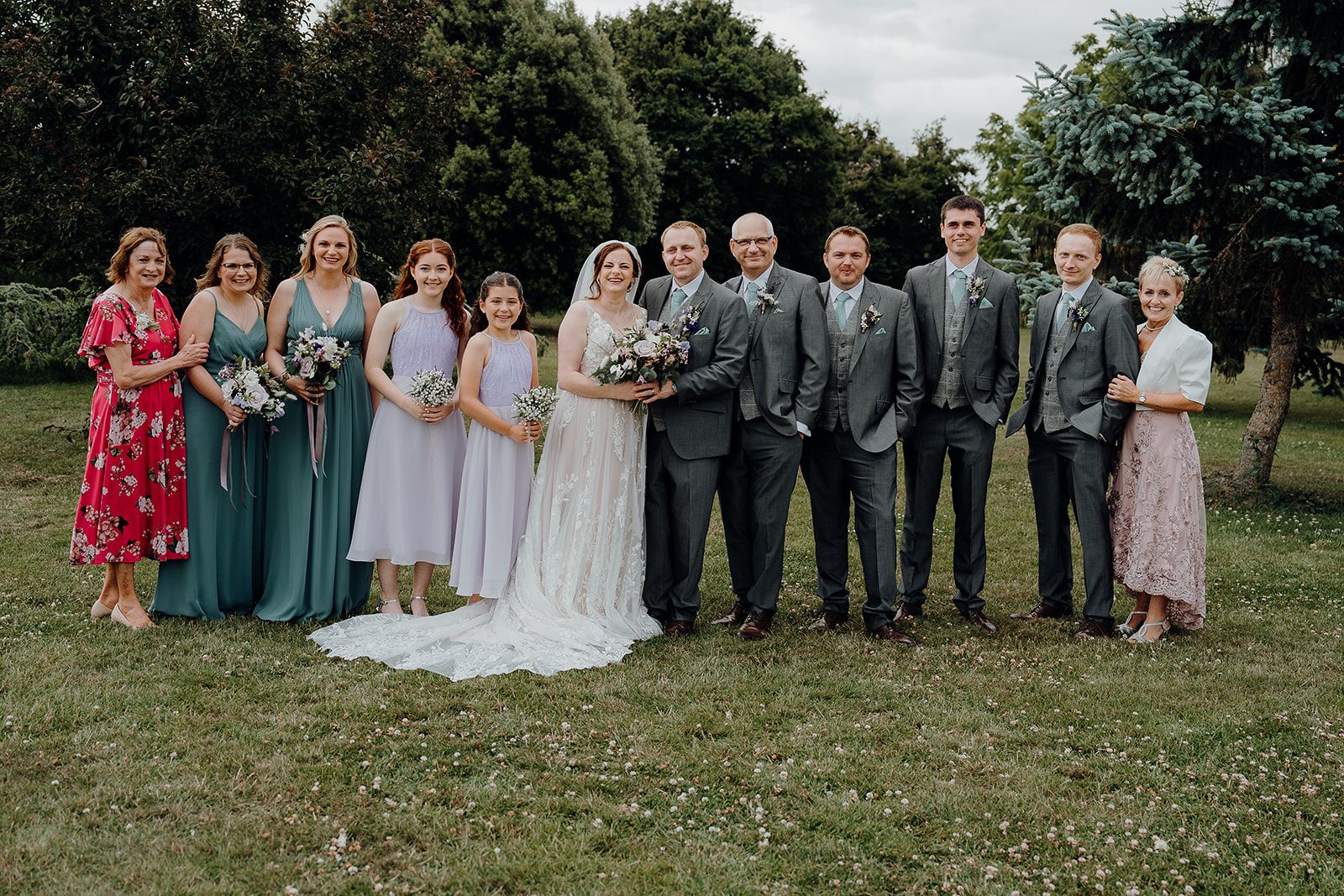 Formal family photo during the afternoon reception of Georgie and James' wedding at Huntsmill Farm. Photo thanks Sam and Steve Photography. 