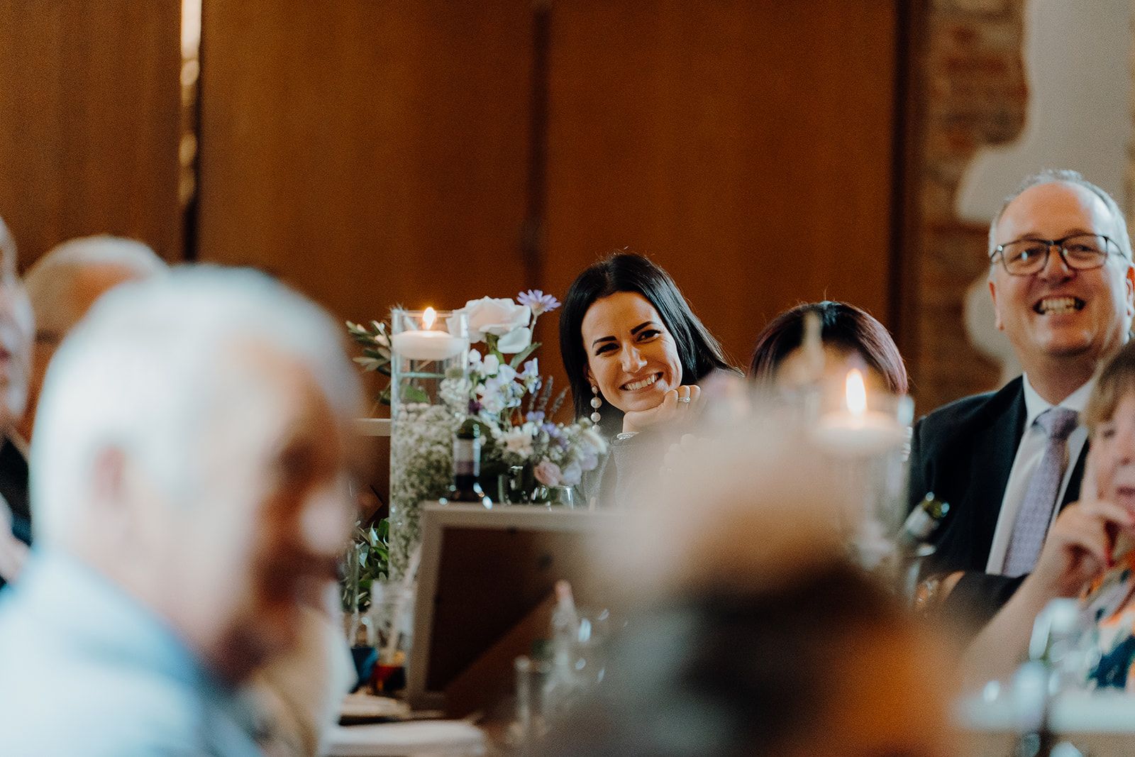 Georgie and James' guests laughing during the wedding speeches. Photo thanks to Sam and Steve Photography.