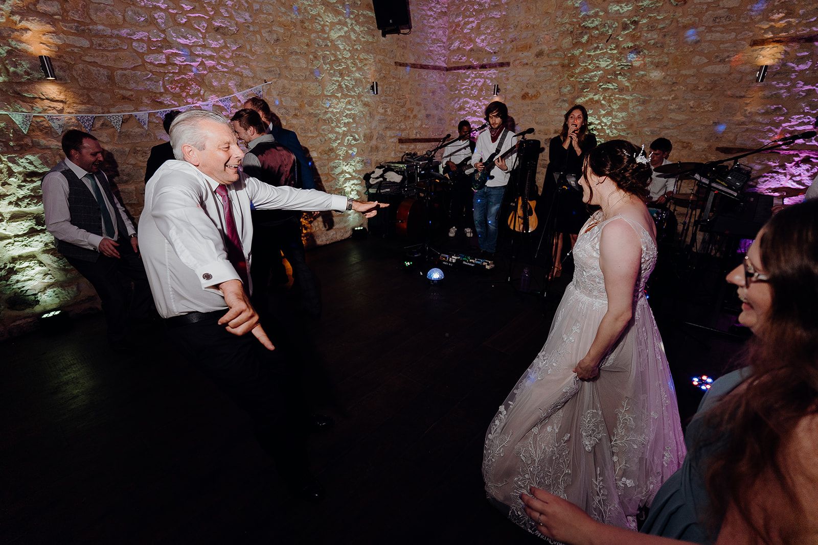 Georgie dancing with guests and Slideways band in the background on the dance floor at Huntsmill Farm. Photo thanks to Sam and Steve Photography. 