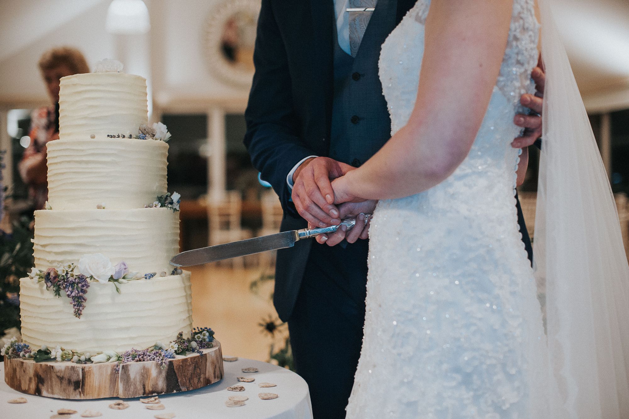 Tarryn and Lee about to cut their gorgeous 4 tier wedding cake by Teacups and Tandems. Photo thanks to Studio Rouge.