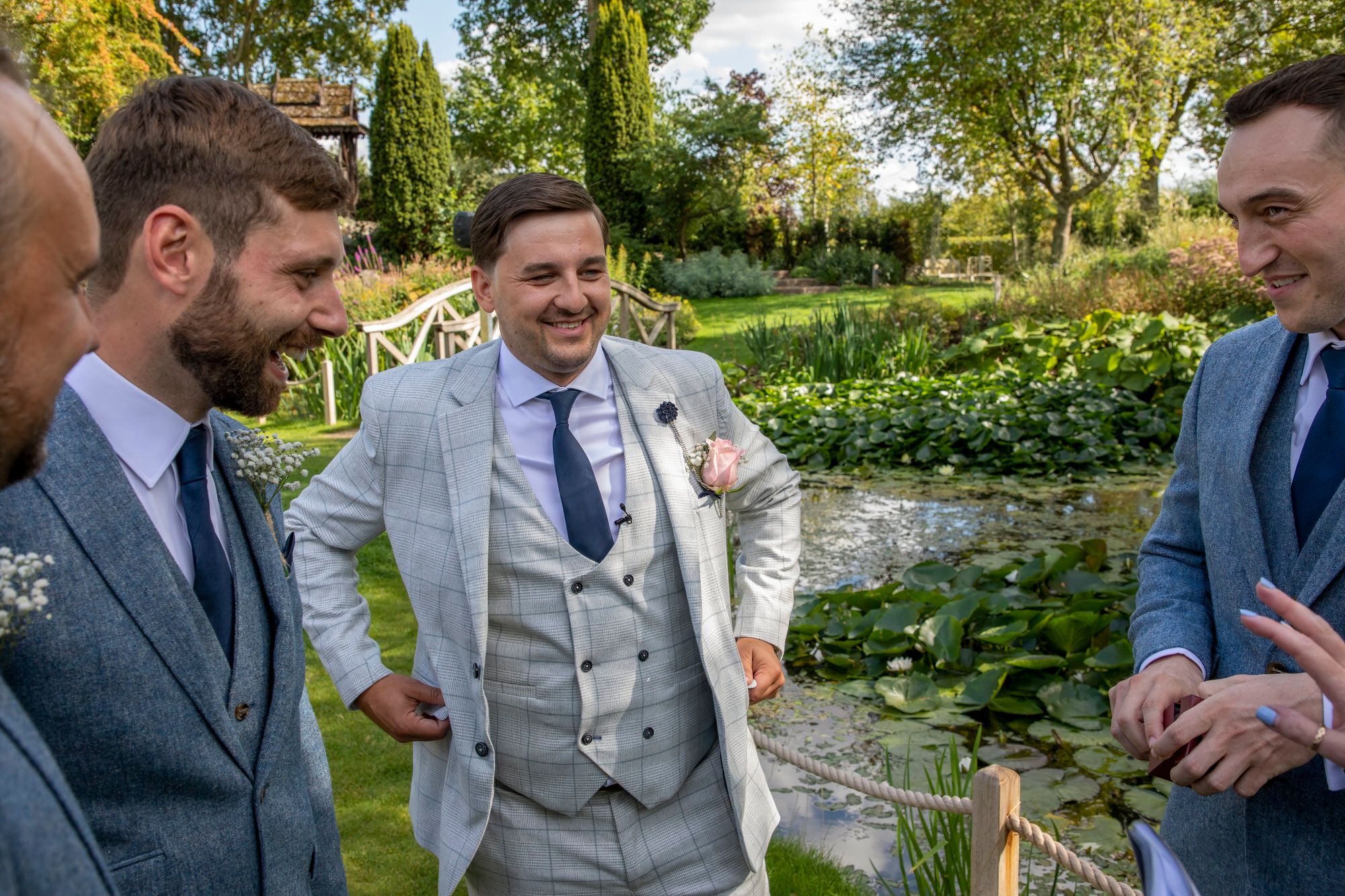 Rafal and his groomsmen waiting by the lily pond ahead of the wedding ceremony. Photo thanks to Nigel Charman Photography. 