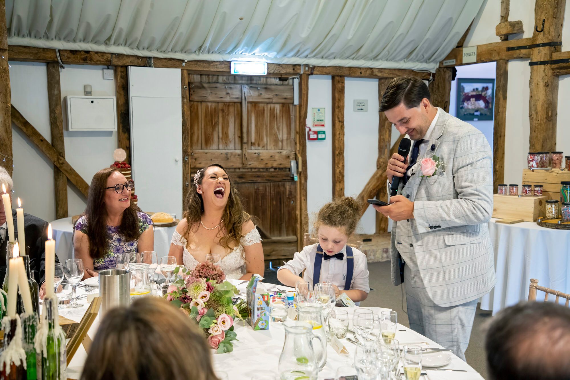 Rafal making his speech in the barn at South Farm - new wife Joanna laughing. Photo thanks to Nigel Charman Photography. 