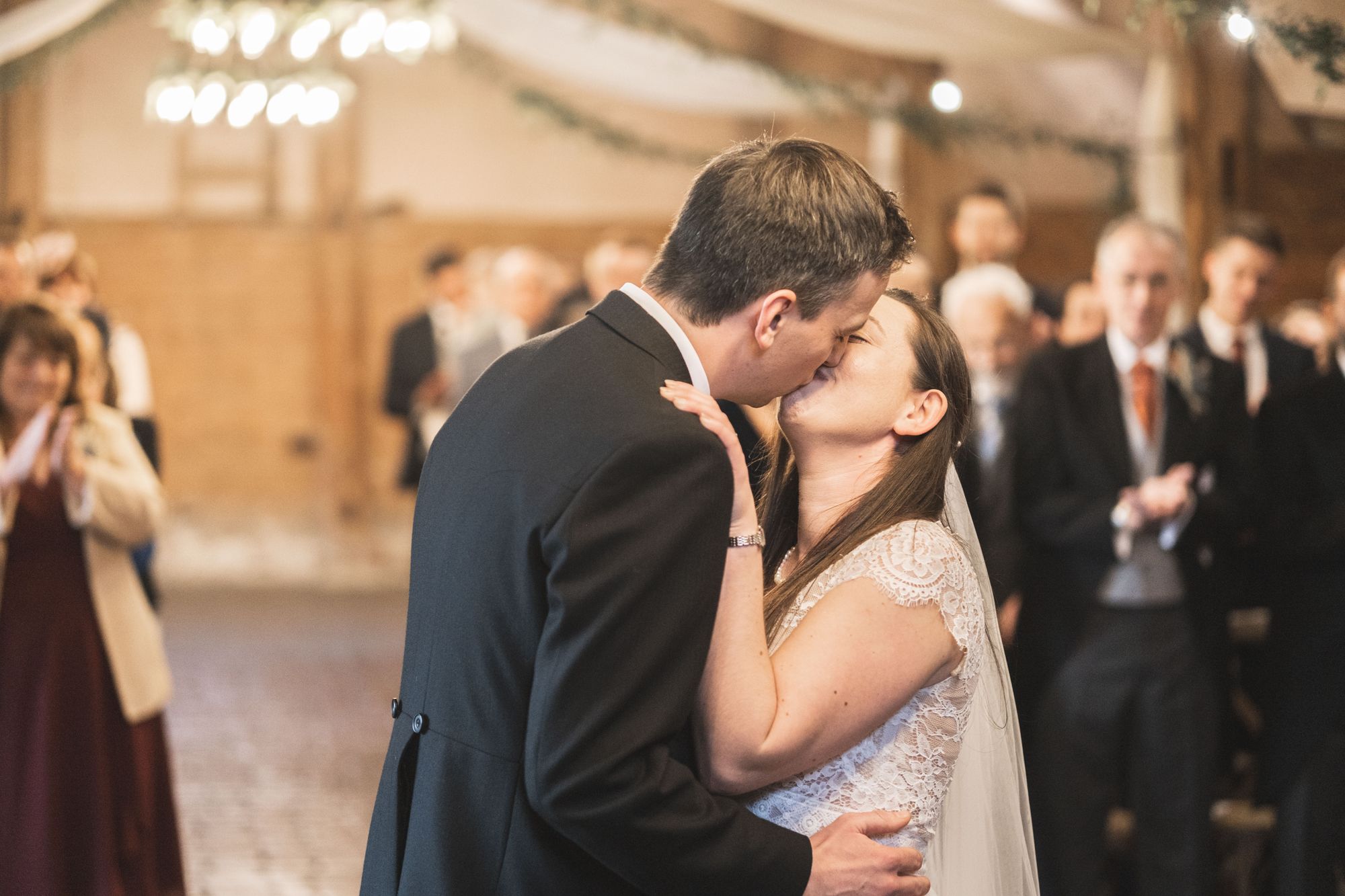 Jennifer and James first kiss as husband and wife at Lains Barn. Photo thanks to The Falkenburgs via Big Day Productions