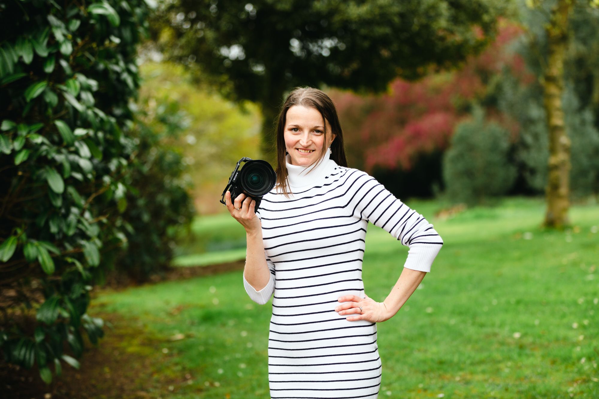 Rachel from Veiled Productions with her Sony A7SIII and 24-70 lens in the centre of the image. Photo taken in the grounds of Bourton Hall by Pete Washer - Rachels husband.